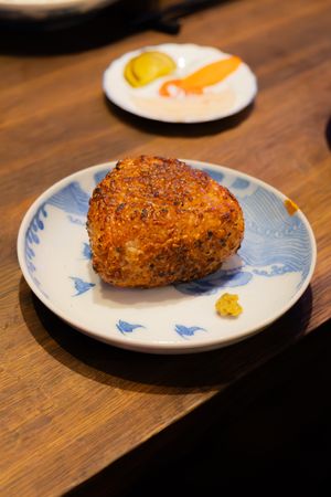 Crispy breaded cutlet served on a traditional blue and white patterned plate.