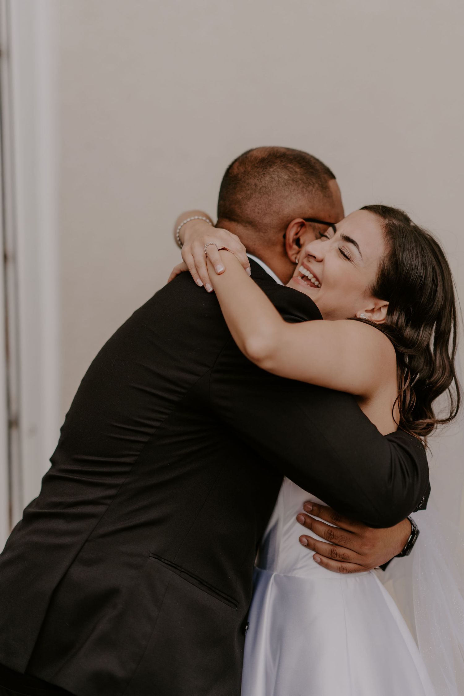 An intimate embrace captured during a wedding celebration.