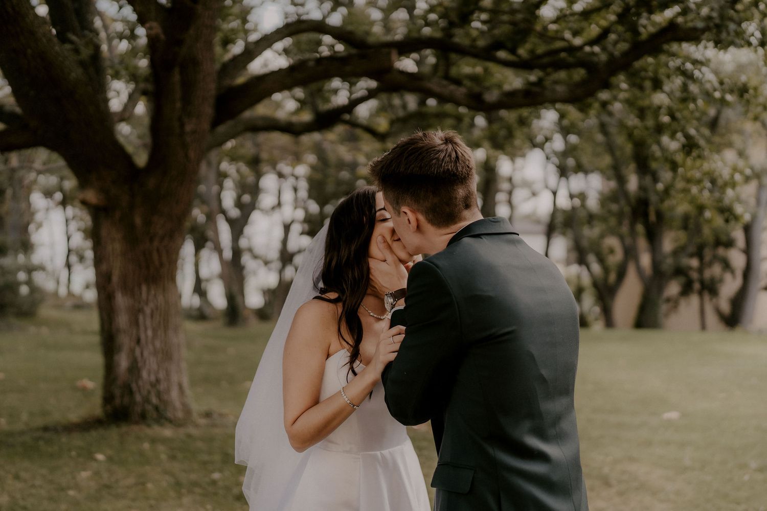 A romantic wedding moment captured in a serene garden setting.
