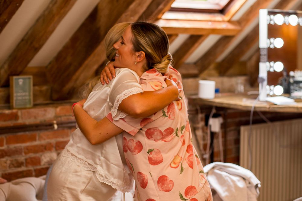Casual gathering in an attic space with exposed wooden beams and natural lighting.