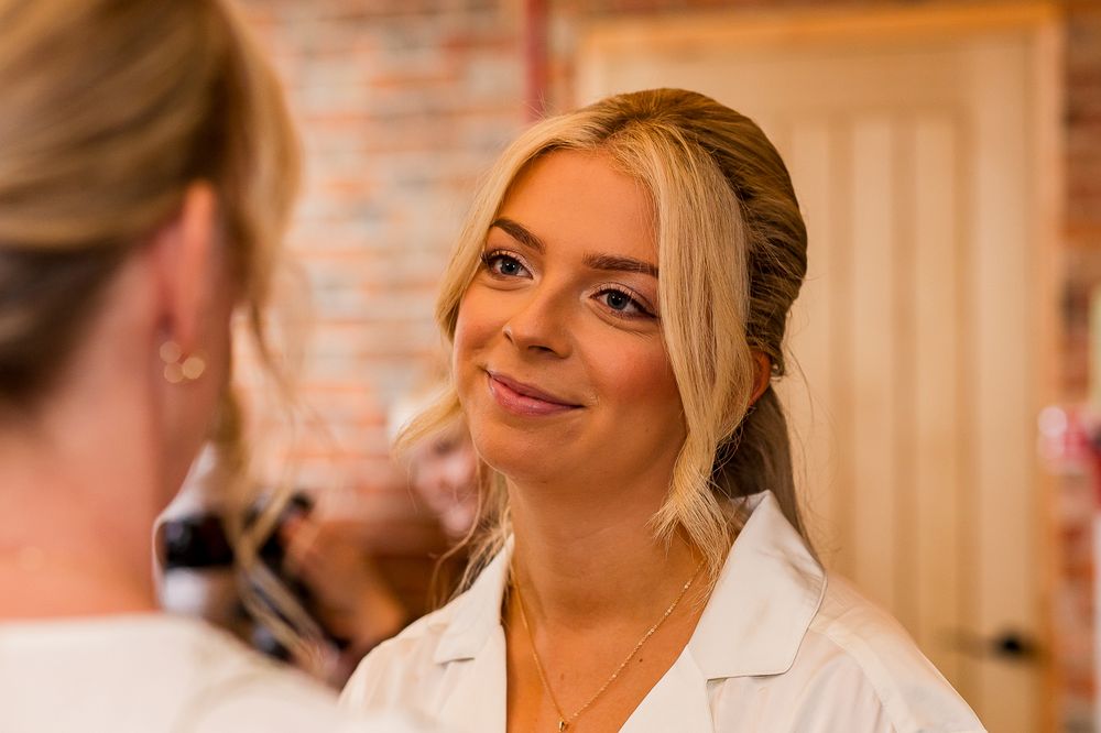 Candid moments captured in a rustic room with exposed brick walls.