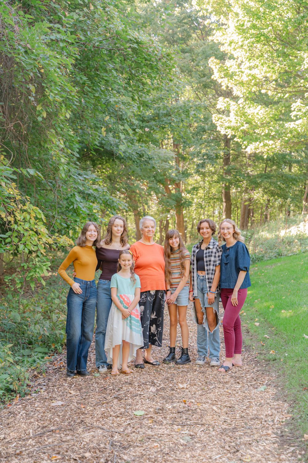 family photo on path in the woods