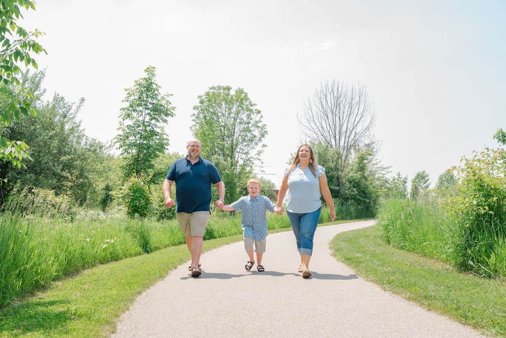 family holding hands and walking