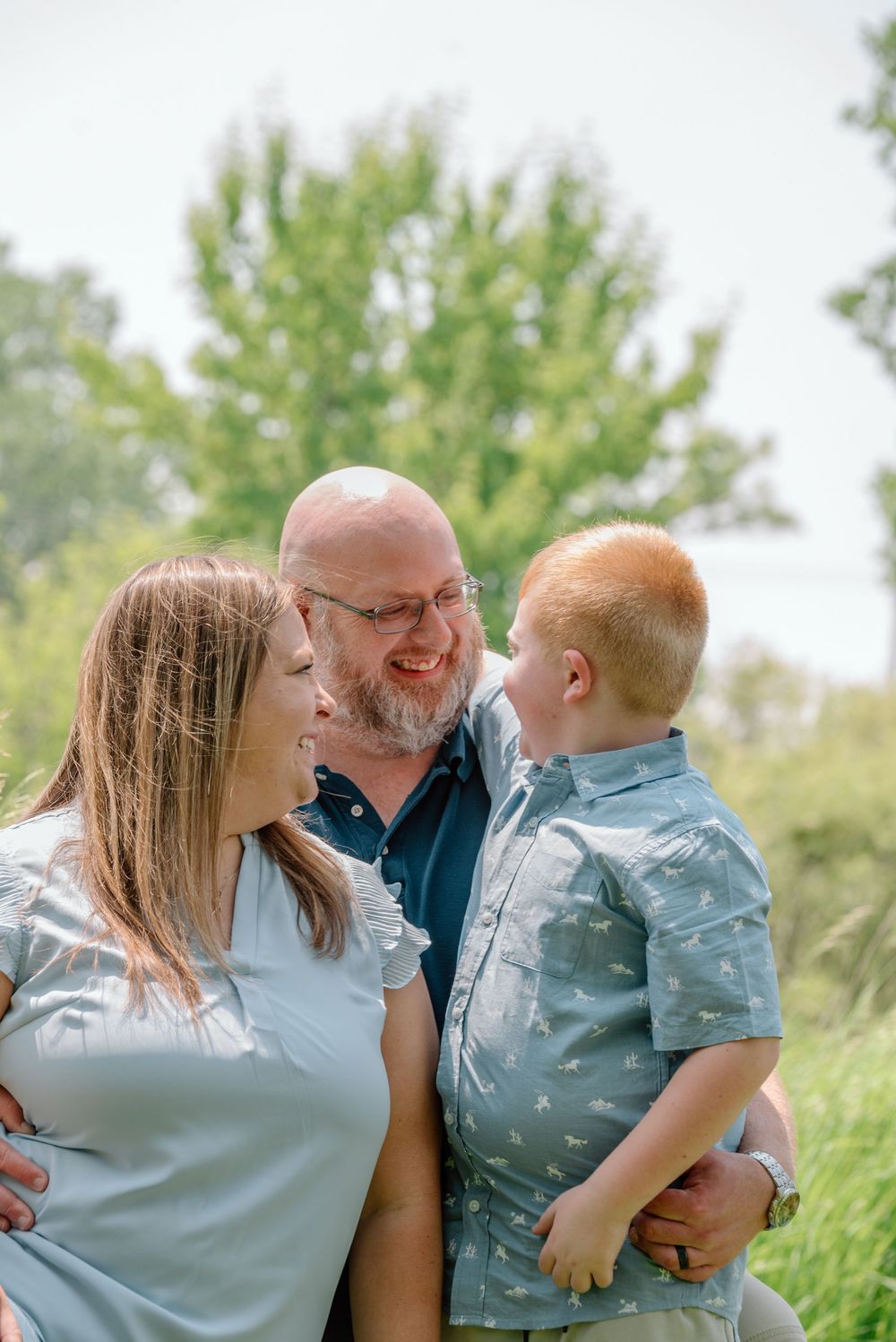 family smiling at each other