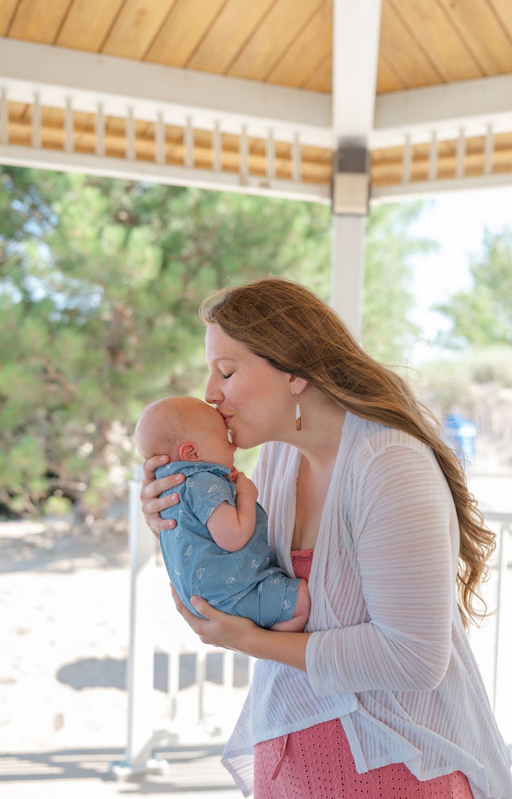 mother kissing her baby