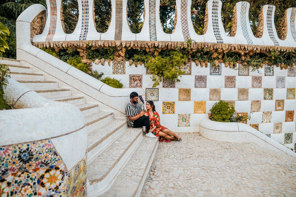 Gentle forehead kiss under arches