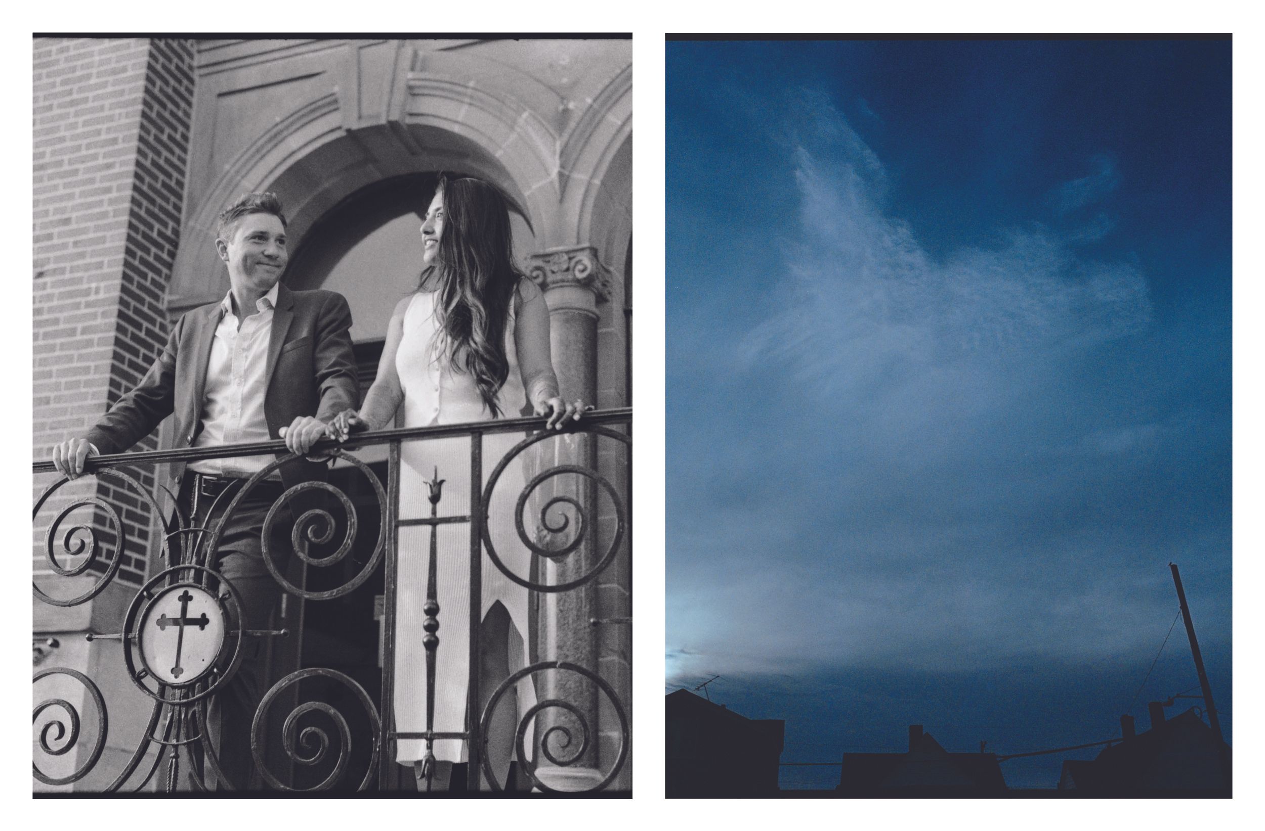 Couple posing on ornate iron balcony with cross detail outside brick church building.