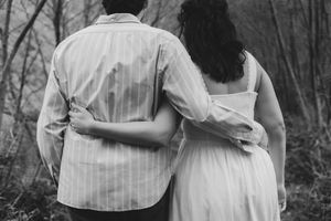 Natural and candid engagement shoot in Gloucestershire woodland by documentary wedding photographer.
