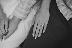 Romantic engagement photography session in Forest of Dean woodland with soft natural light and relaxed posing.