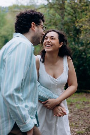 Candid pre wedding photoshoot in Gloucestershire forest capturing real emotions and connection between couple.