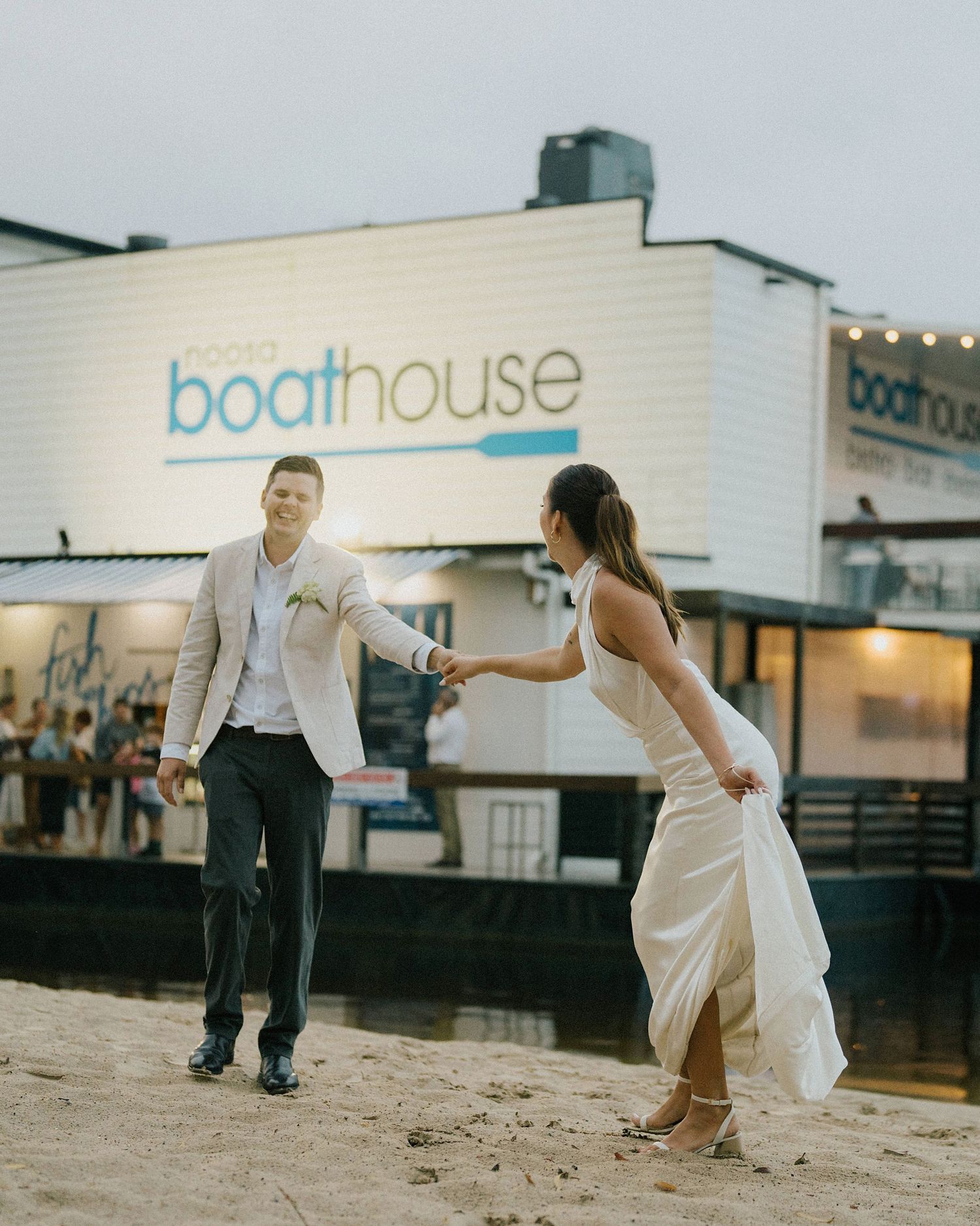 27.	“Candid waterfront wedding portraits at Noosa Boathouse, captured by a Sunshine Coast storytelling photographer.”