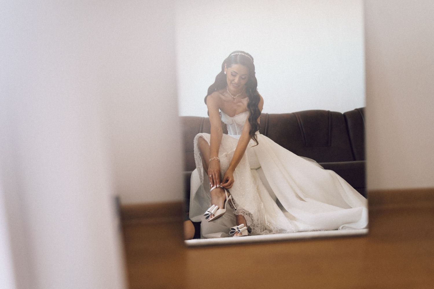 A sequence of wedding photos showing a bride in a white dress posing in different positions on a white background.