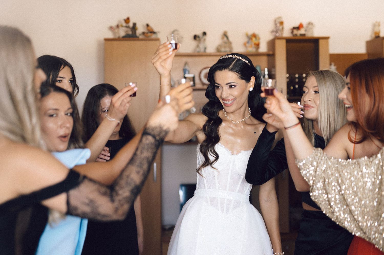 A montage of wedding preparation moments shows stylists working on hair and makeup for a bridal party.