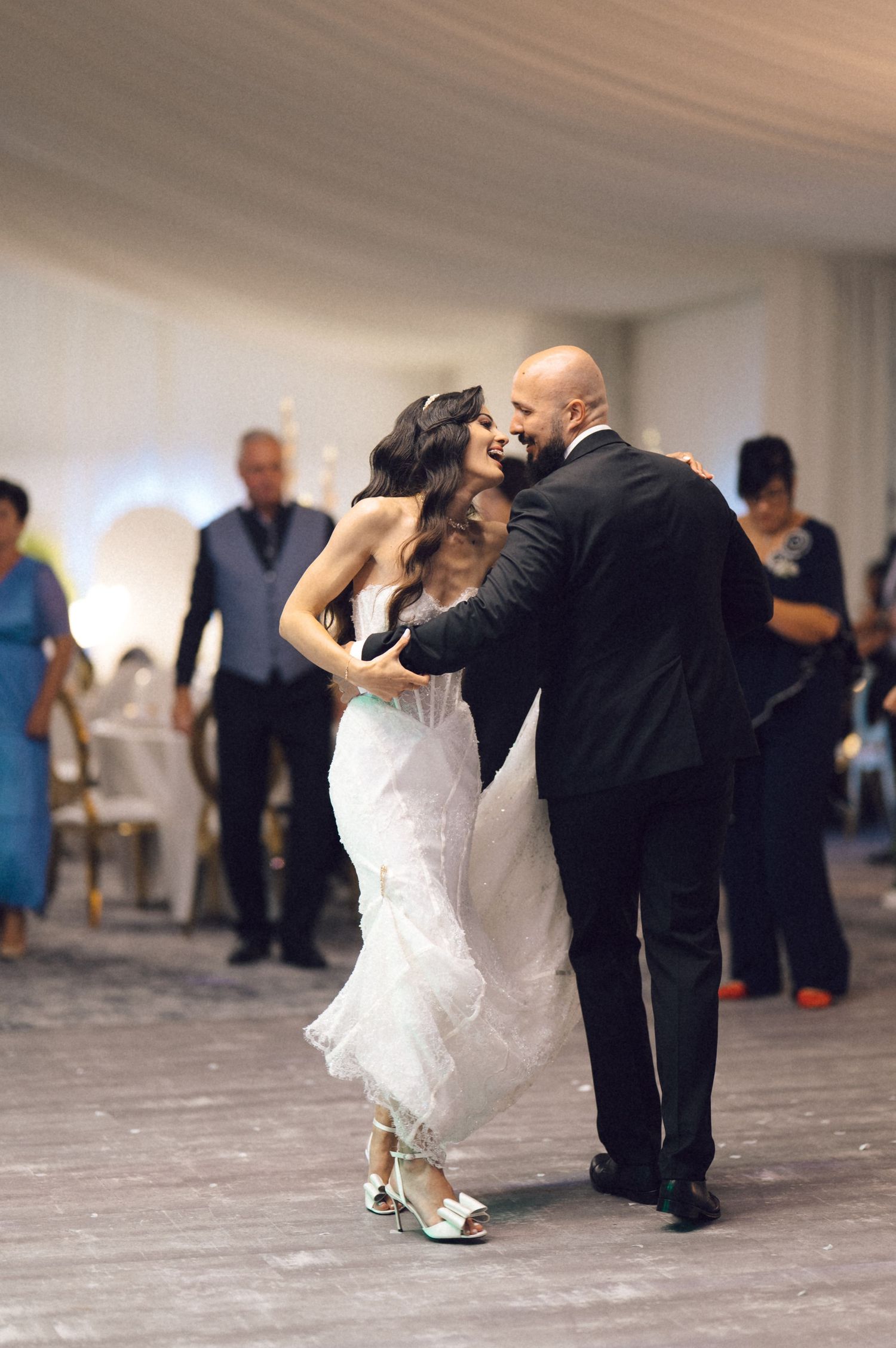 A sequence of dance moves showing a couple performing a dramatic dip on a ballroom dance floor.