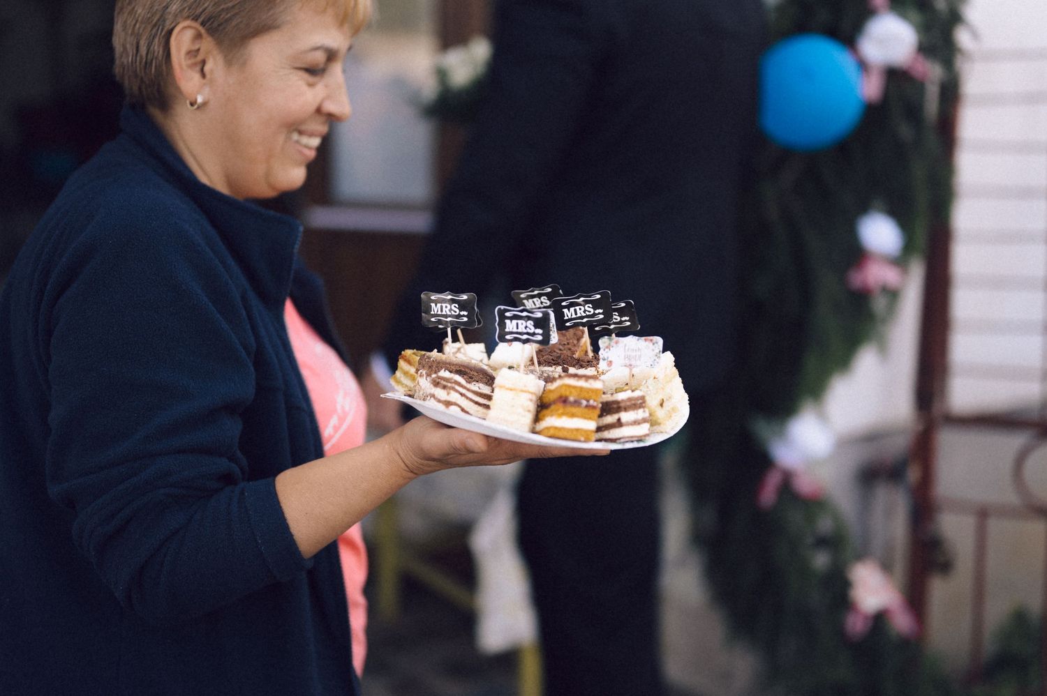 Wedding guests enjoying appetizers and refreshments at an outdoor reception.