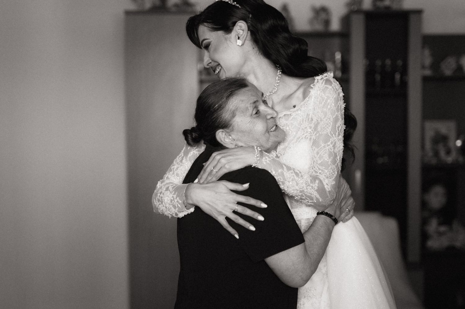 A series of five black and white photos showing a couple dancing together at a wedding reception.