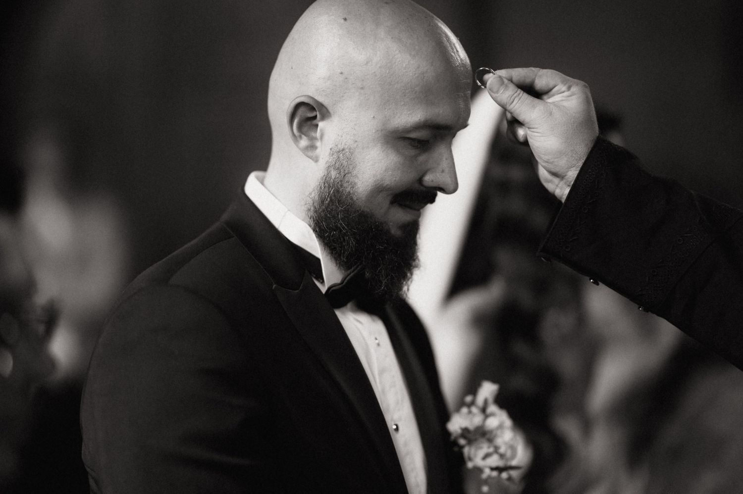 A black and white collage of wedding photos showing intimate moments between a bride and groom.