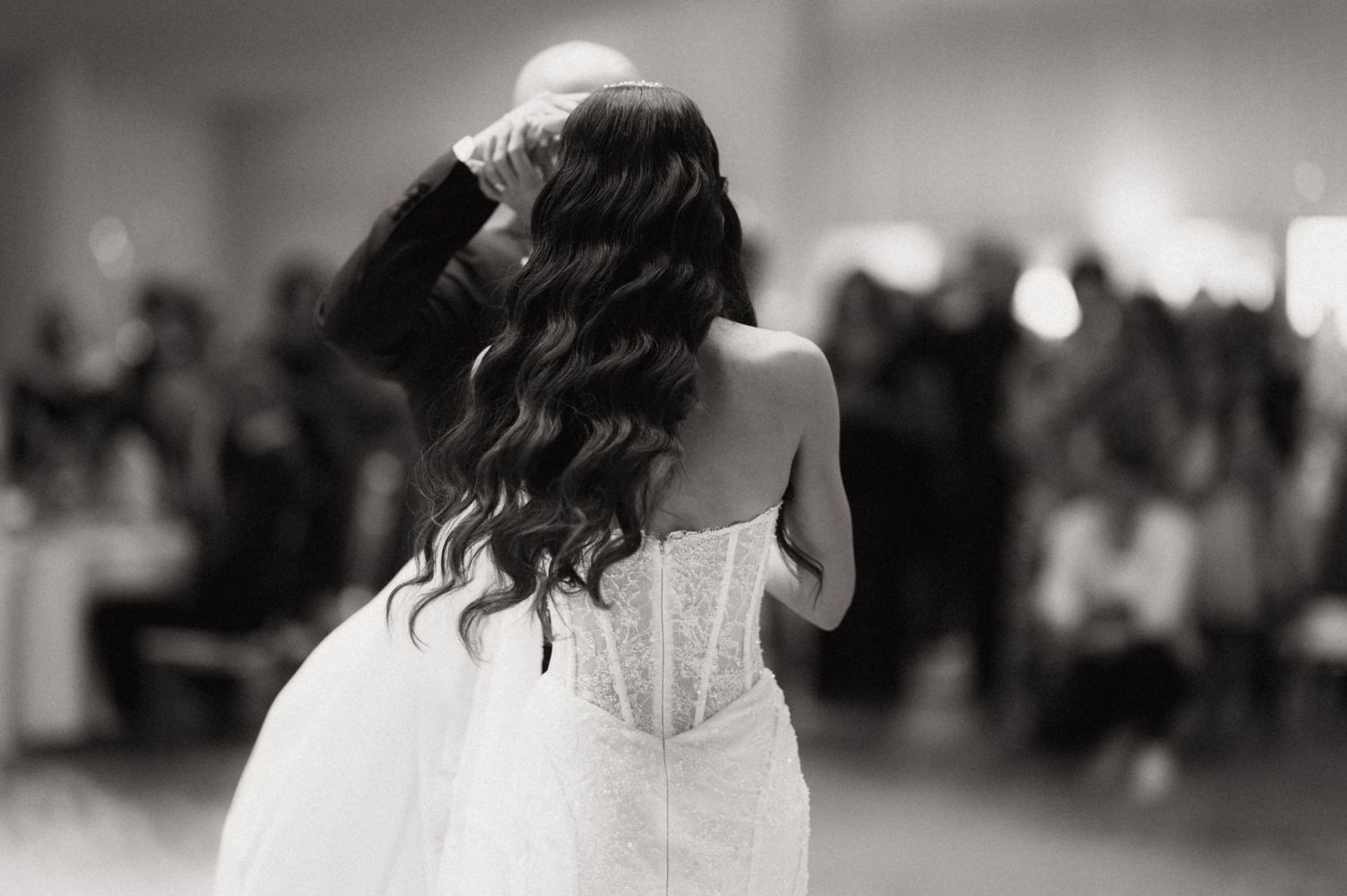 A black and white wedding photo montage shows intimate moments between a couple during their celebration.