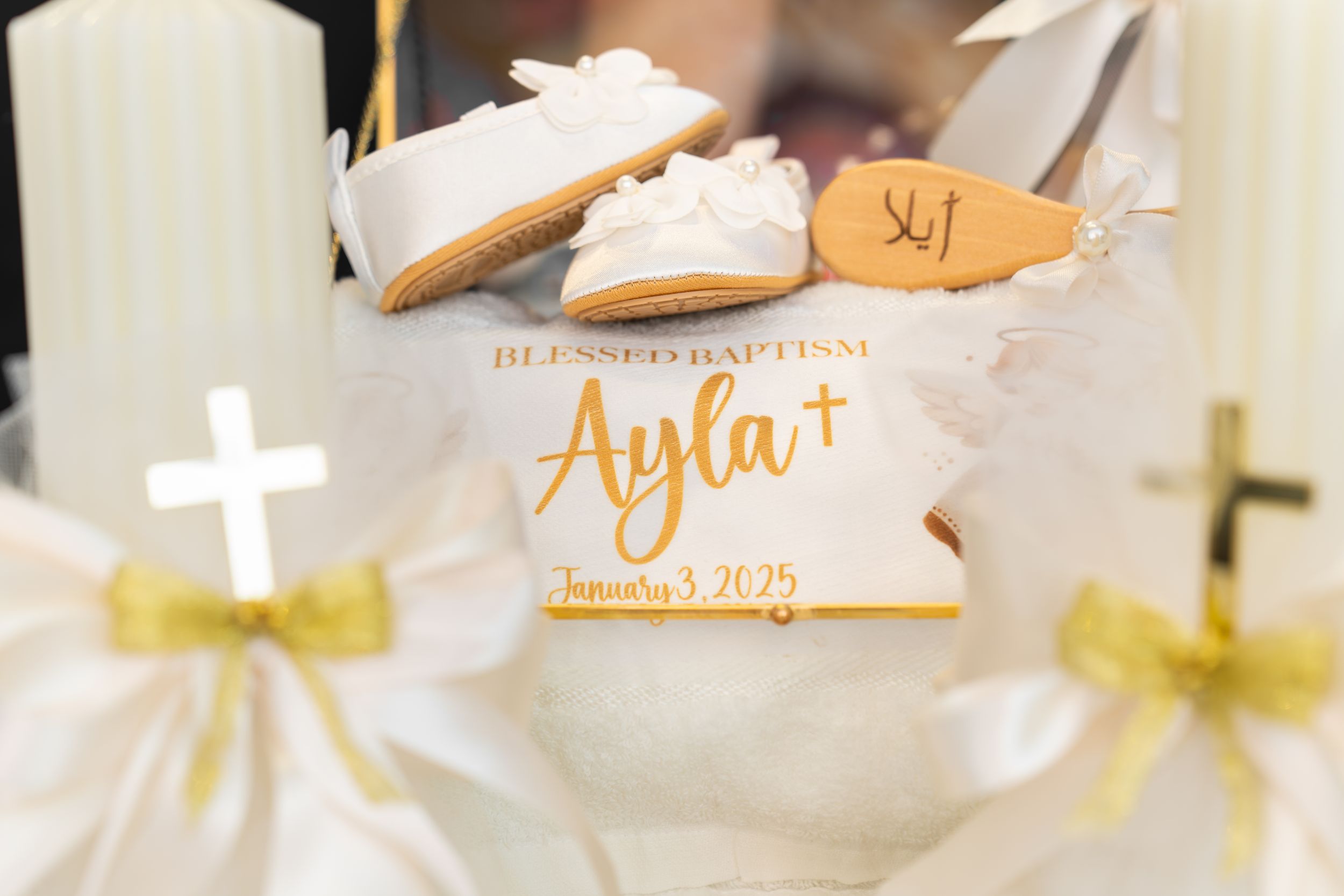 White paper name cards with gold calligraphy writing arranged in a row at an elegant event setting.