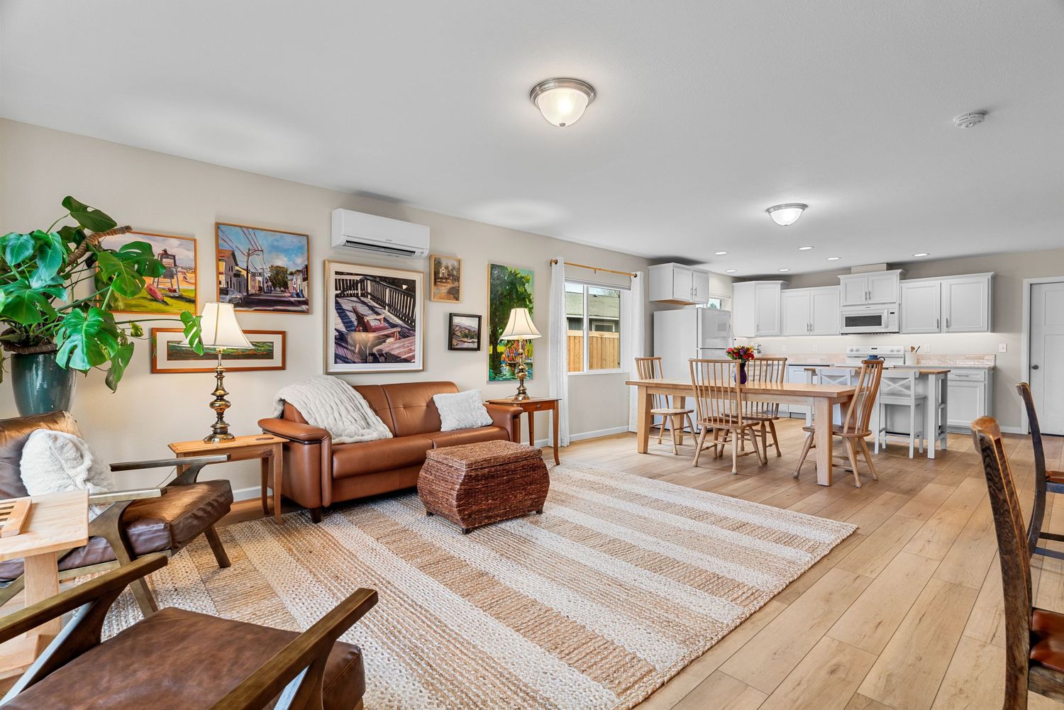 Open-concept living and dining area with modern finishes and spacious layout for home listing in Ellensburg, WA