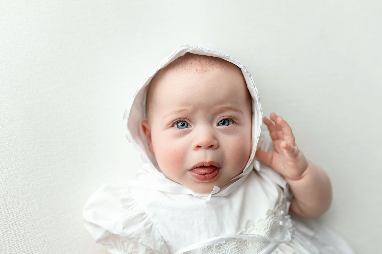 A baby girl in a white dress. Greenville SC newborn photographer, Easley SC newborn photographer, Upstate newborn photographer
