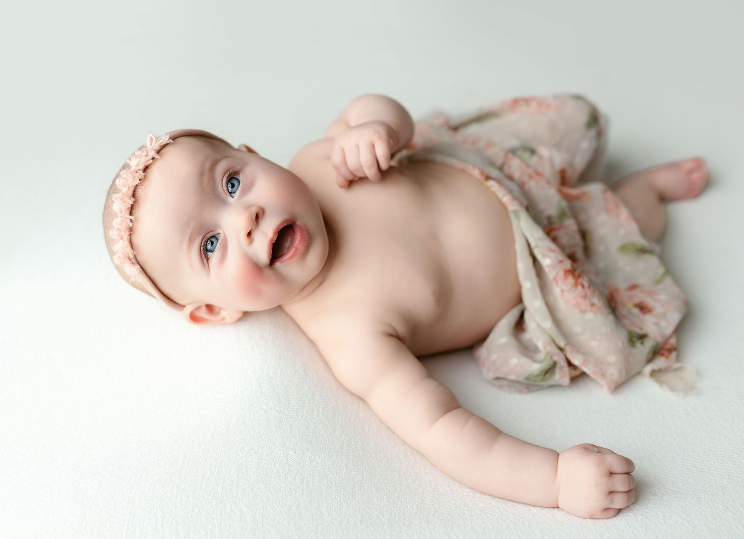 A baby girl in a white dress. Greenville SC newborn photographer, Easley SC newborn photographer, Upstate newborn photographer