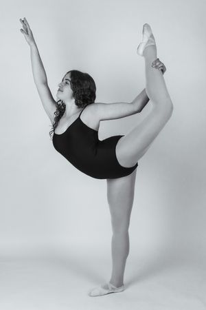 Professional dance portrait in Ridgefield CT studio with controlled lighting and minimalist backdrop focusing on movement and form Ballet
