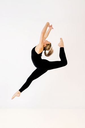 Professional dance portrait in Ridgefield CT studio with controlled lighting and minimalist backdrop focusing on movement and form Ballet