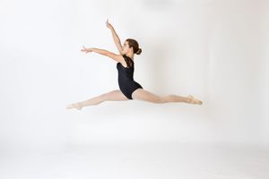 Professional dance portrait in Ridgefield CT studio with controlled lighting and minimalist backdrop focusing on movement and form Ballet