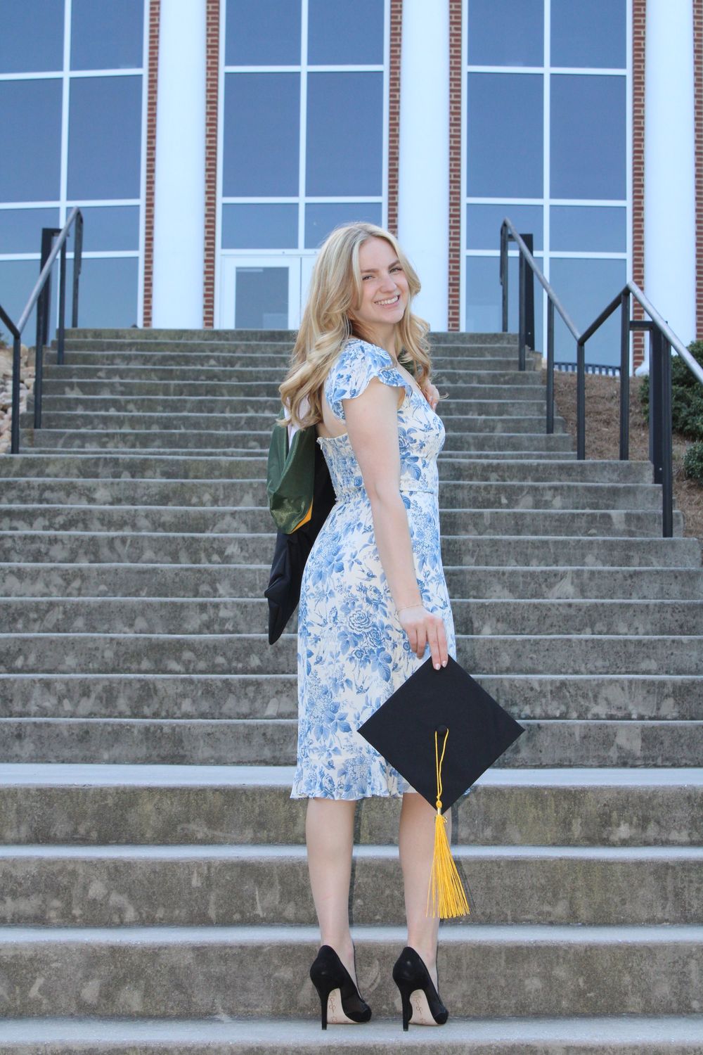 girl walking up stairs and smiling