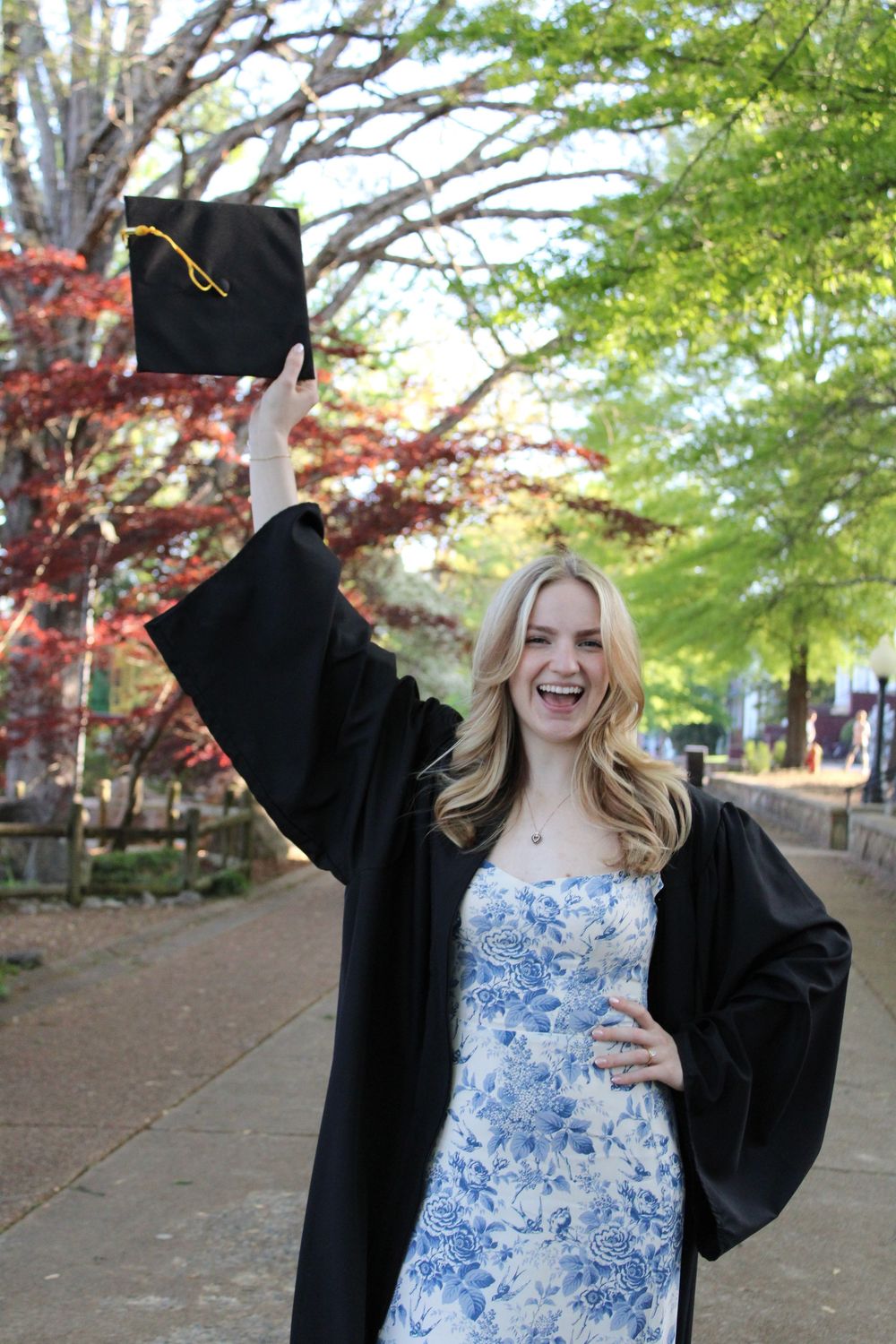 girl throwing graduation cap in the air