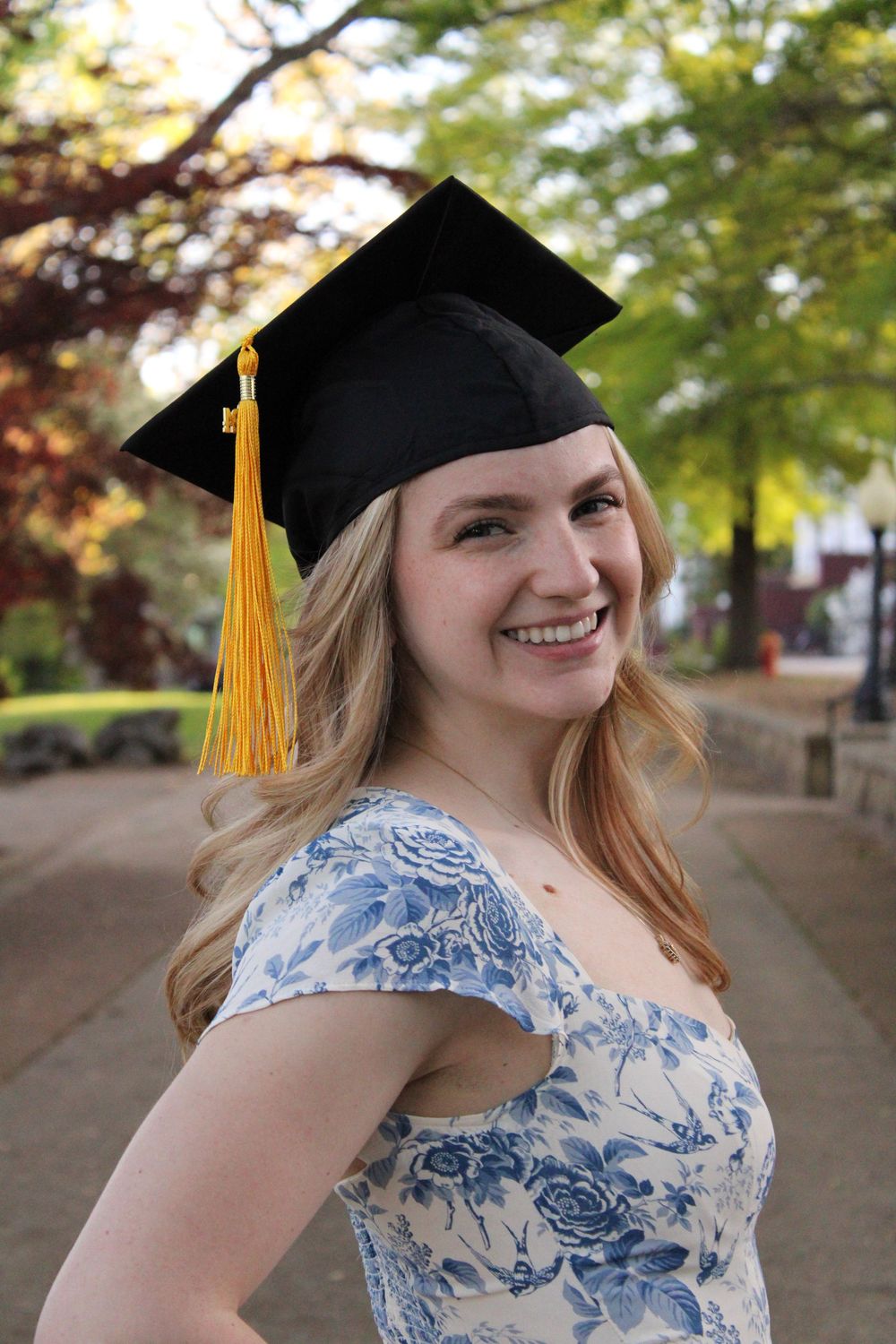 girl smiling wearing graduation cap