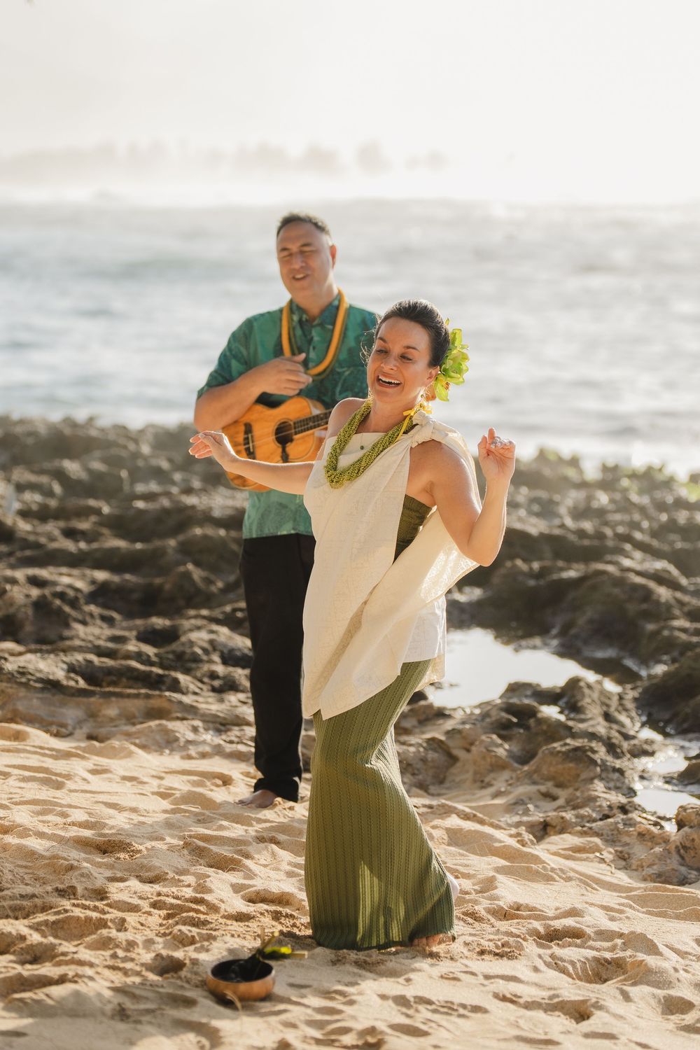 A romantic beach wedding ceremony at North Shore Oahu Hawaii.
Officiant Kelehua.
Video Bishop Media.
 Hula Dancer