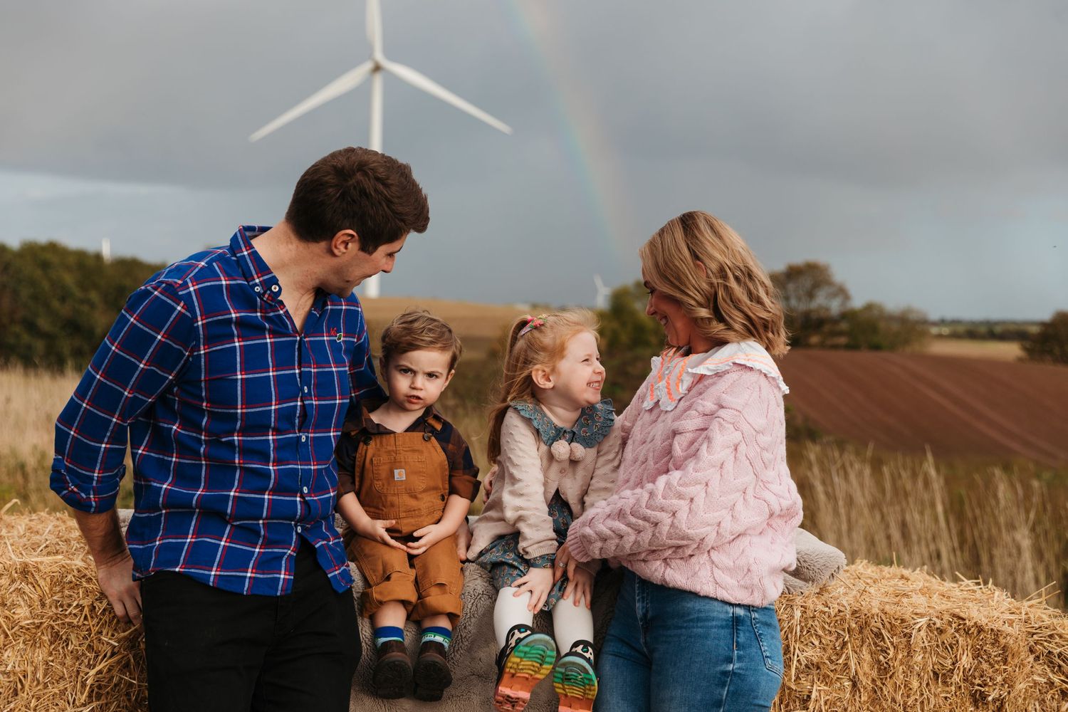Wind turbines stand tall in the background of a rural autumn field scene. Photographer. Hull. East Yorkshire. Photography