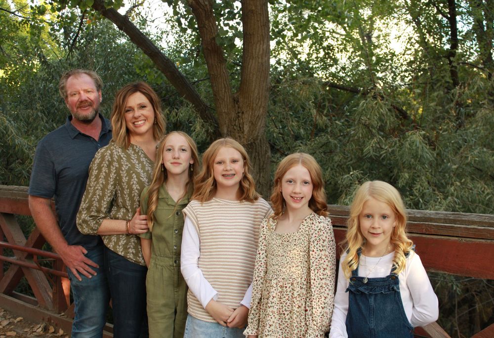 A series of outdoor family portraits taken in a wooded setting with natural lighting and greenery in the background.