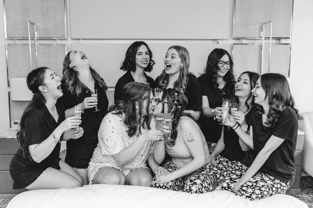 A group of friends sharing laughter and joy in a black and white photo collage.