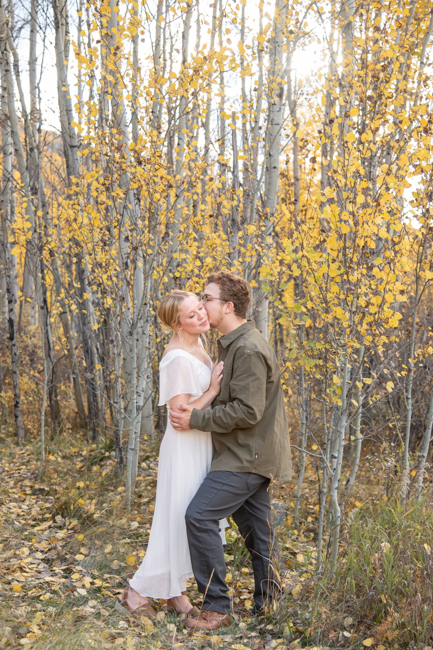 fall engagement session with yellow aspen leaves and fall trees in Vail Colorado.