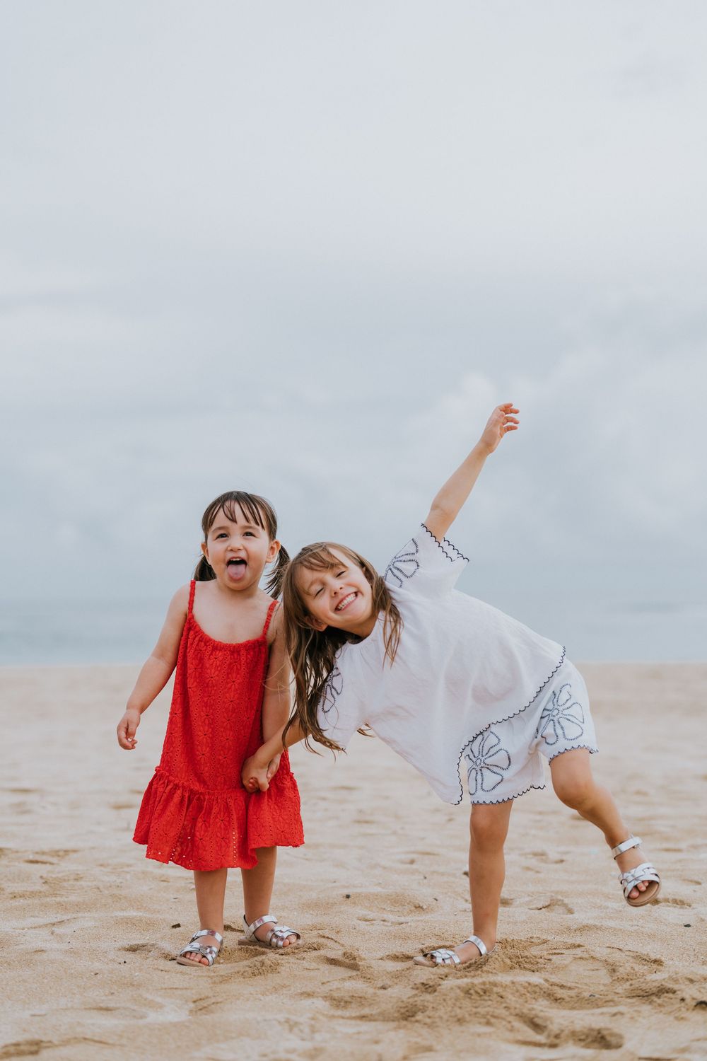 Beach family photography in Bali with an 
ocean backdrop