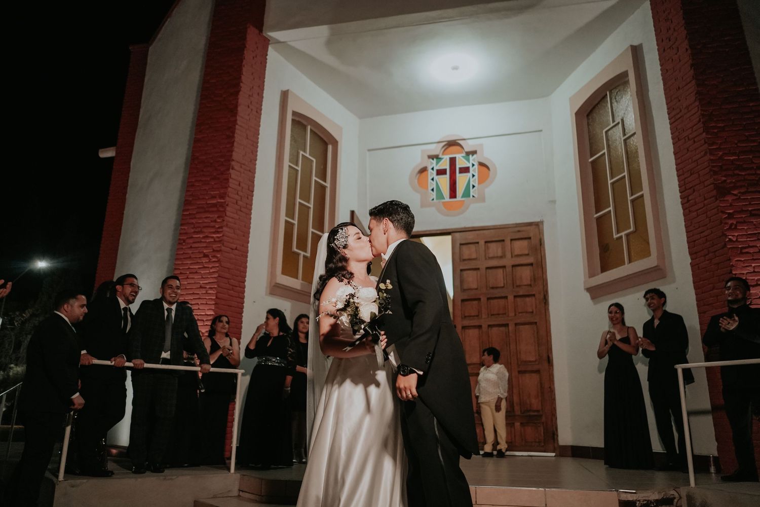 A wedding ceremony takes place in a church with red walls and wooden paneling, captured in multiple candid moments.
