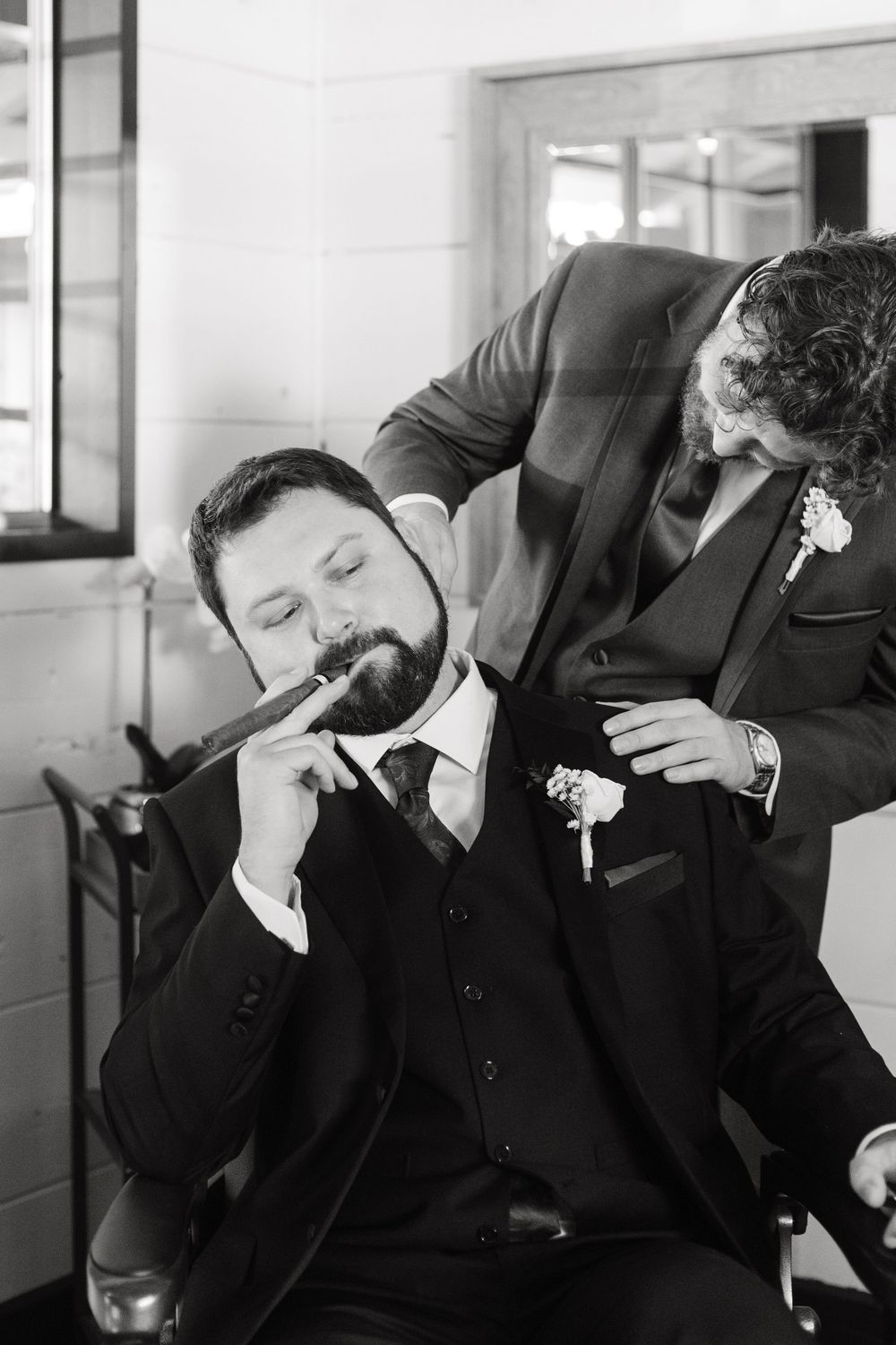 A series of black and white photos showing a person in a suit bending over and leaning forward.