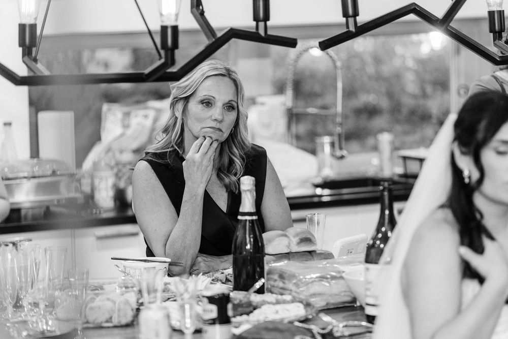A collection of black and white photos showing people dining and socializing at restaurant tables.