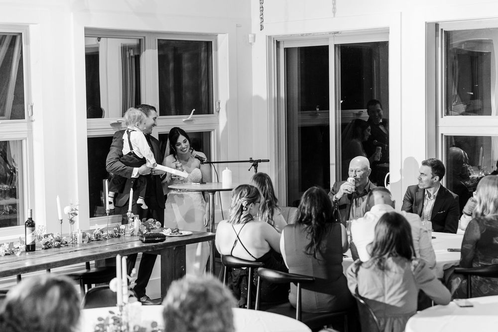Musicians perform at a wedding reception in a black and white photo series showing multiple angles of the celebration.