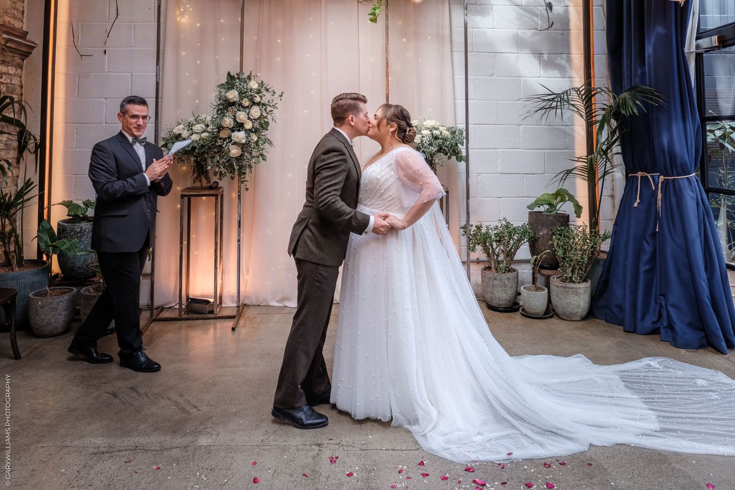 Five wedding photos in sequence showing a romantic ceremony and reception in an elegant indoor venue.
