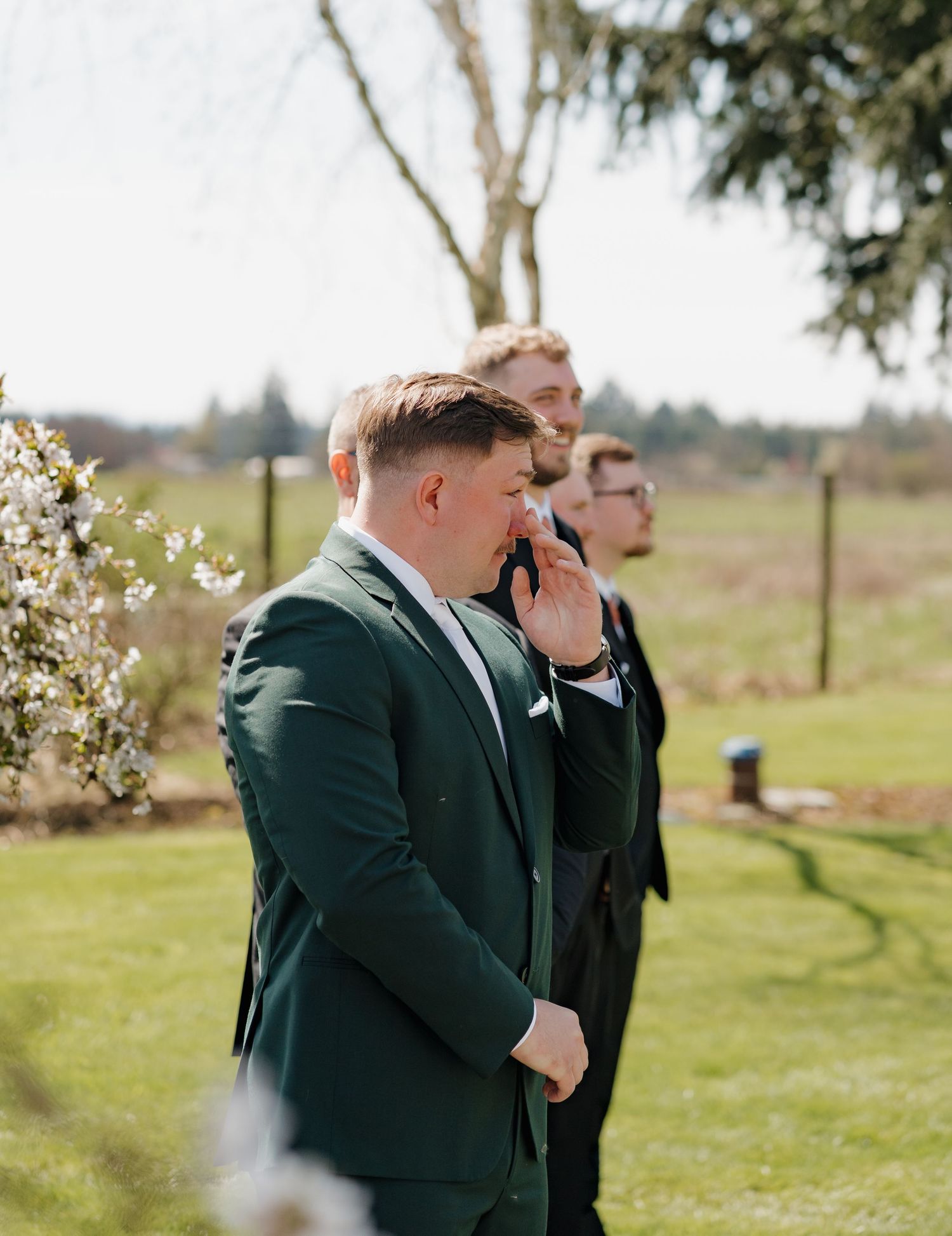 A series of four emotional moments showing a groom's heartfelt reaction during a wedding ceremony in an outdoor setting. Leavenworth, WA