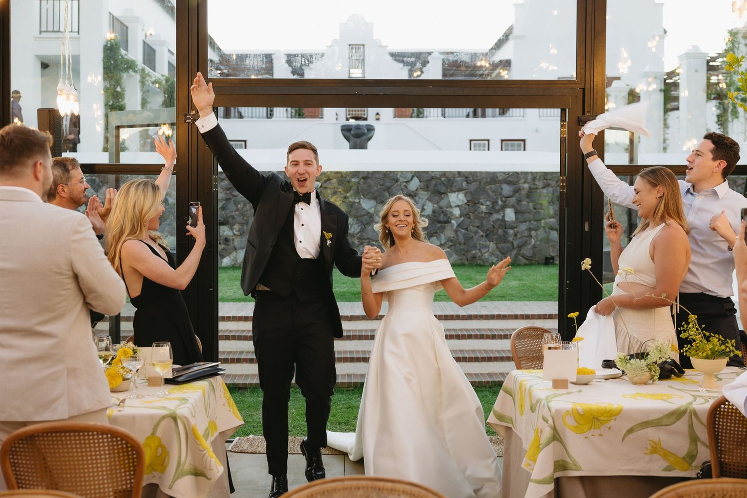 A series of candid wedding reception moments showing dancing, laughter and celebration at an indoor venue.