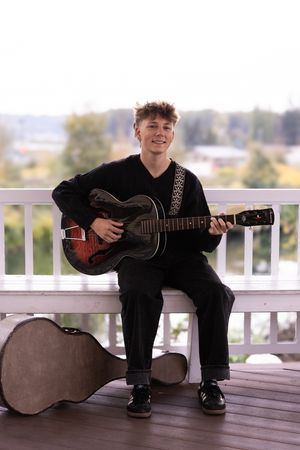 A musician sits on a porch bench with an acoustic guitar, shown in a series of connected artistic shots.