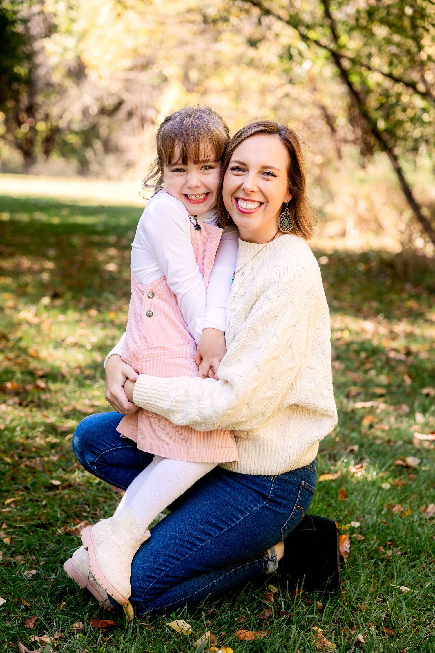 A candid outdoor photo with joyful smiles and laughter from a mom and daughter in Novi, Michigan by Rachel Martinez Photography