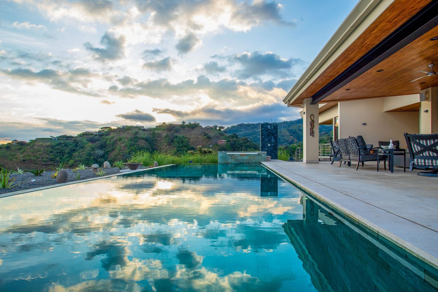 Infinity pool with stunning lake views at a luxury property in Costa Rica, ideal for serene retreats