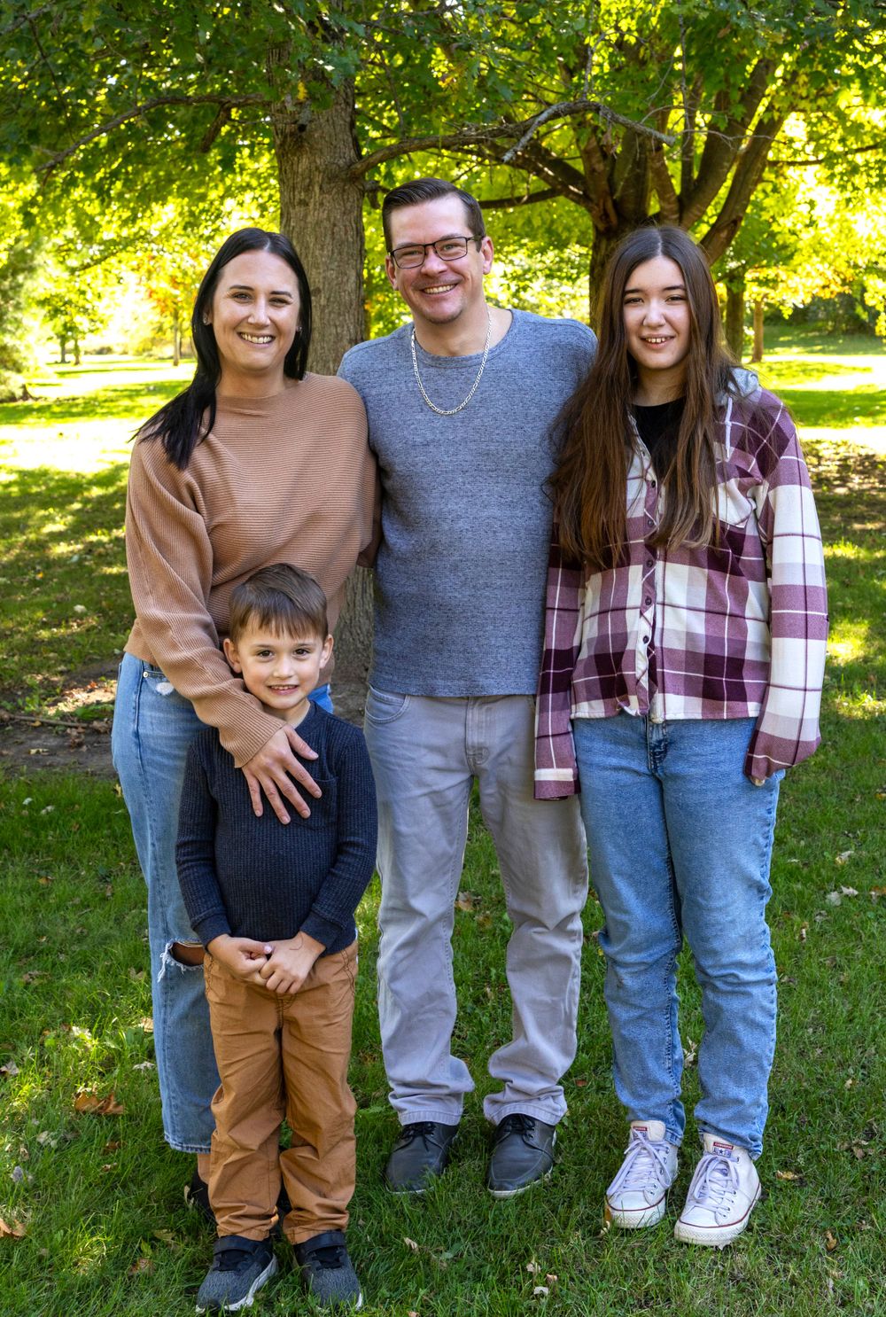 Family of 4 full shot in the early fall