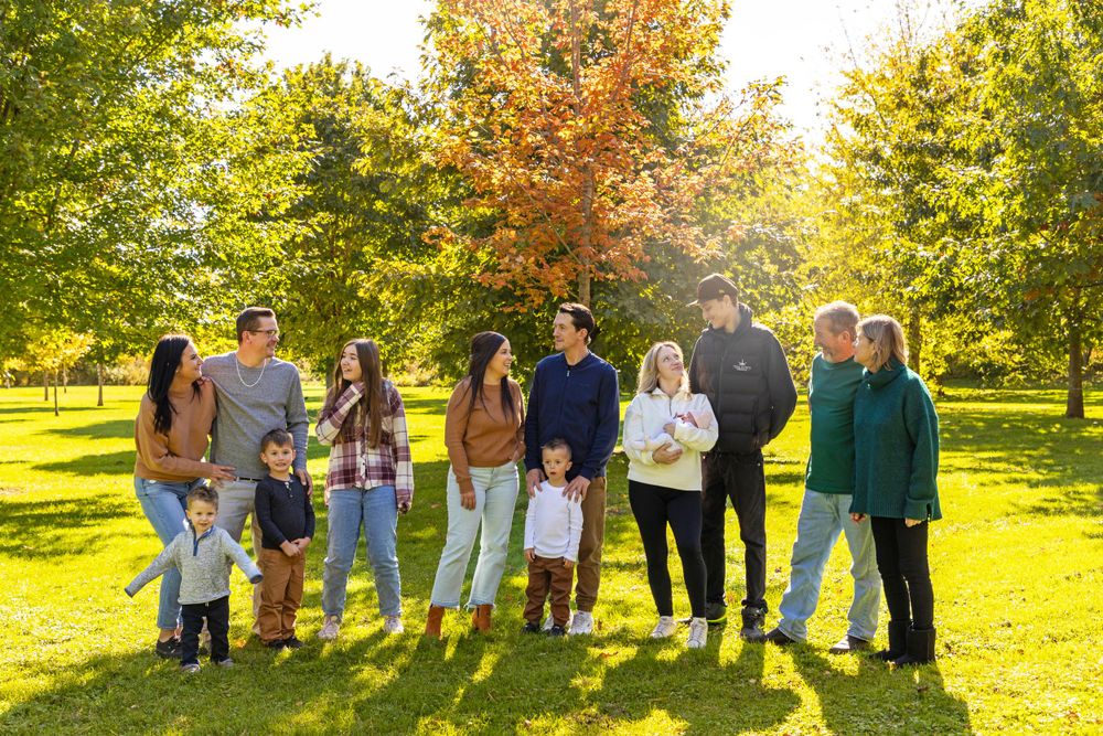 An extended family shoot with multiple family groupings all looking at one another